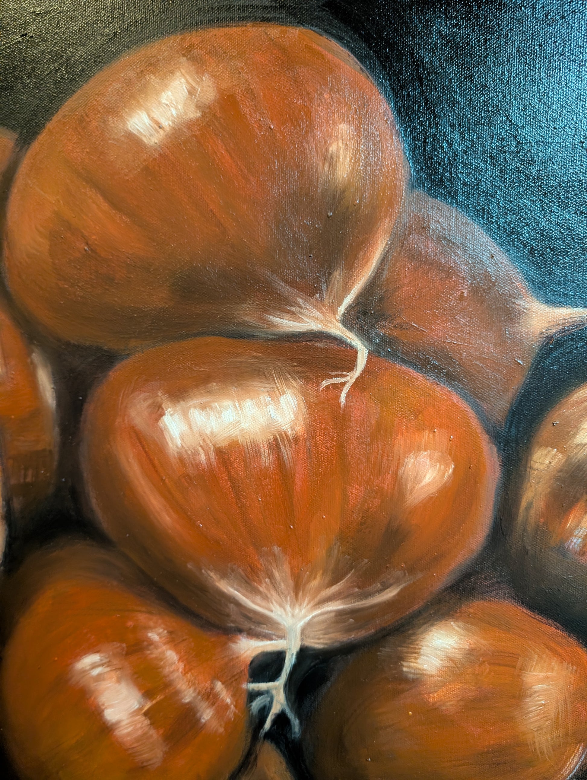 Detail of oil painting of chestnuts on a dark background
