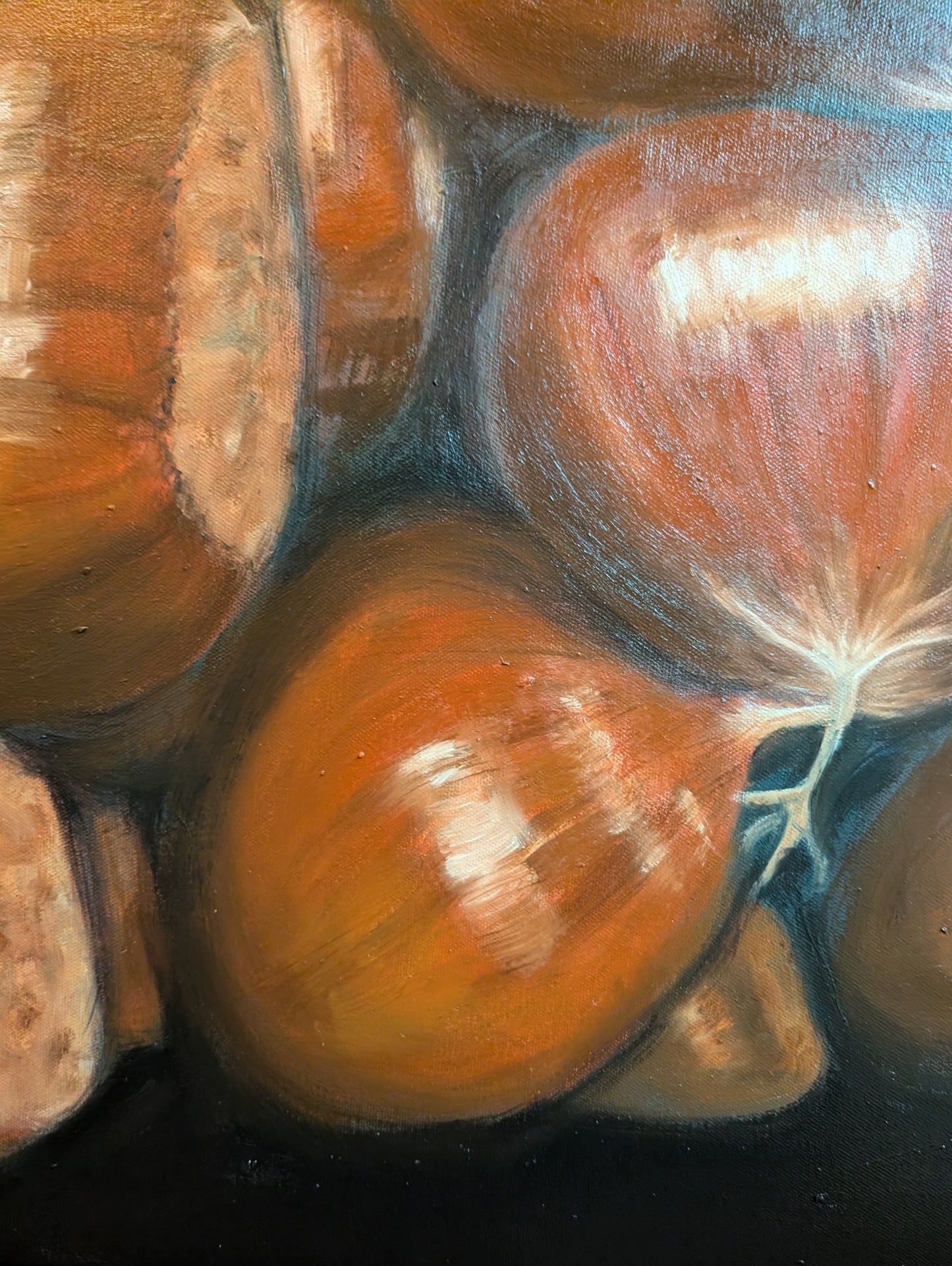 Detail of a painting of chestnuts on a black background