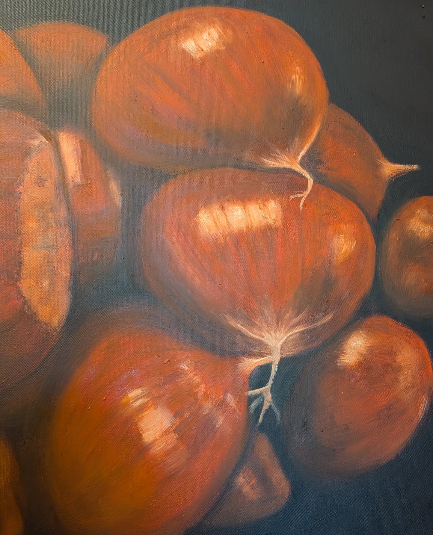 detail of an oil painting of chestnuts on a dark background